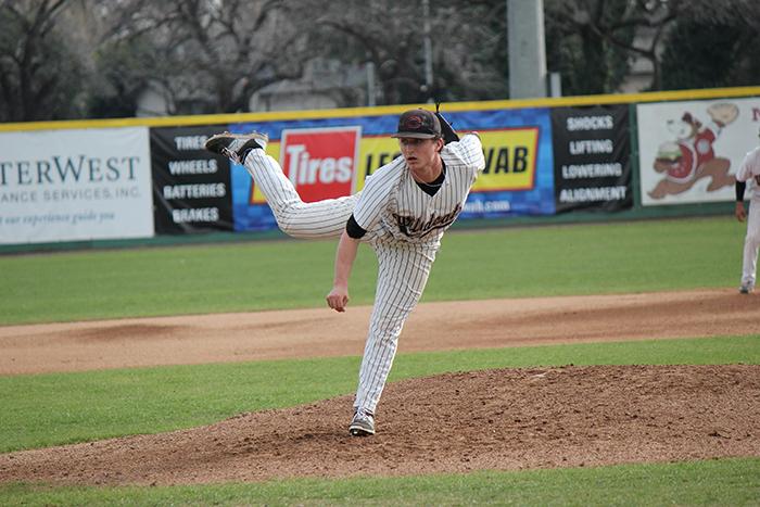 Junior Clayton Gelfand fires a pitch against the Academy of Art on Feb. 12. Photo credit: Lindsay Pincus