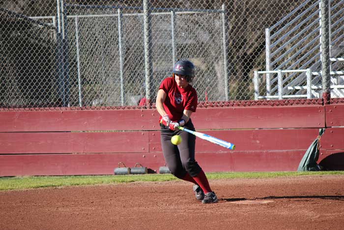 Senior Alli Cook swings at the ball during practice on Jan. 27. Photo credit: Lindsay Pincus