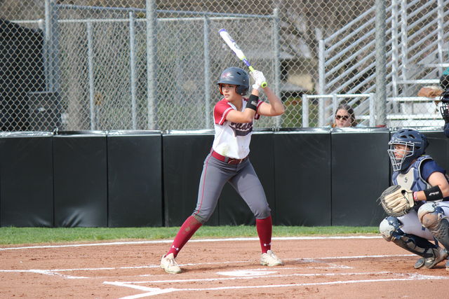 First-year Ari March prepares to hit the ball during the game against Monterey Bay on Feb. 20. Photo credit: Lindsay Pincus