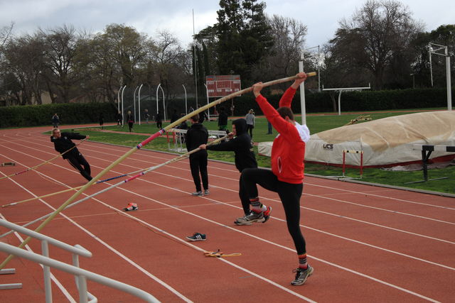 The Chico State track and field team warms up for pole vaulting practice. Photo credit: Cam Lesslie
