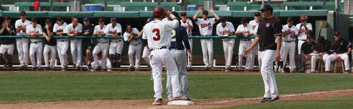 Sophomore infielder Cameron Santos celebrates a triple with the dugout in a game against Cal State Monterey Bay. Photo credit: Allisun Coote