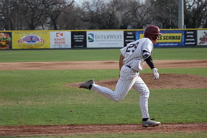 Junior Sonny Cortez runs down the first base line in a game against Academy of Art. Photo credit: Lindsay Pincus