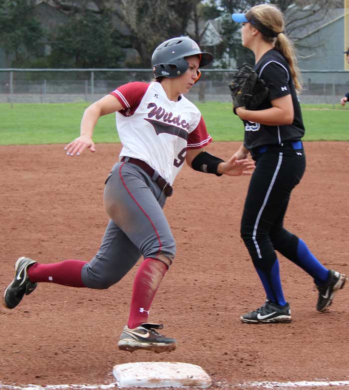 Senior outfielder Alli Cook rounds third base on her way to score for the Wildcats. Photo credit: Lindsay Pincus