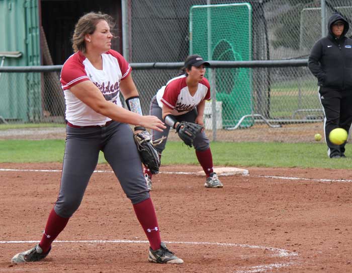 Sophomore pitcher Haley Gilham fires a pitch as her teammates stand ready to field the ball. Photo credit: Lindsay Pincus