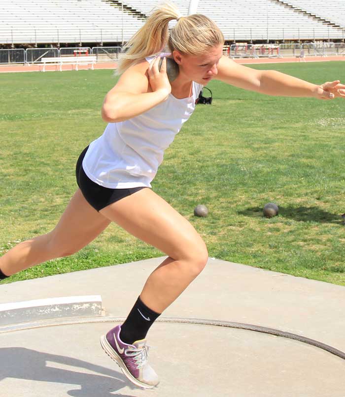 First-year Olivia Abbott winds up to launch the shot put during practice. Photo credit: Cam Lesslie