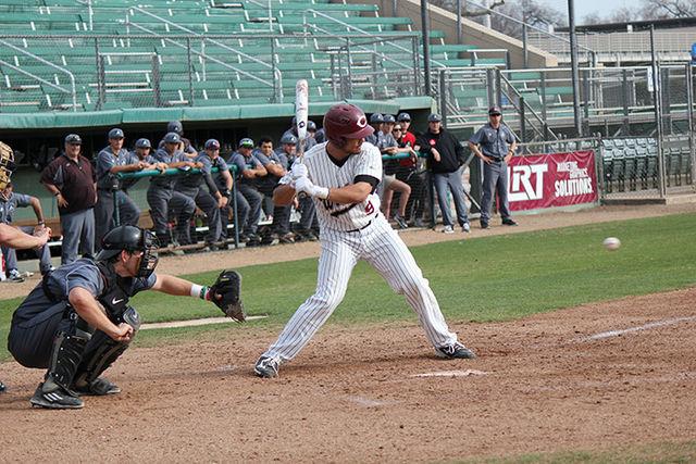 Senior Ben Gamba watches the pitch come across the plate in a game against Academy of Art. Photo credit: Lindsay Pincus