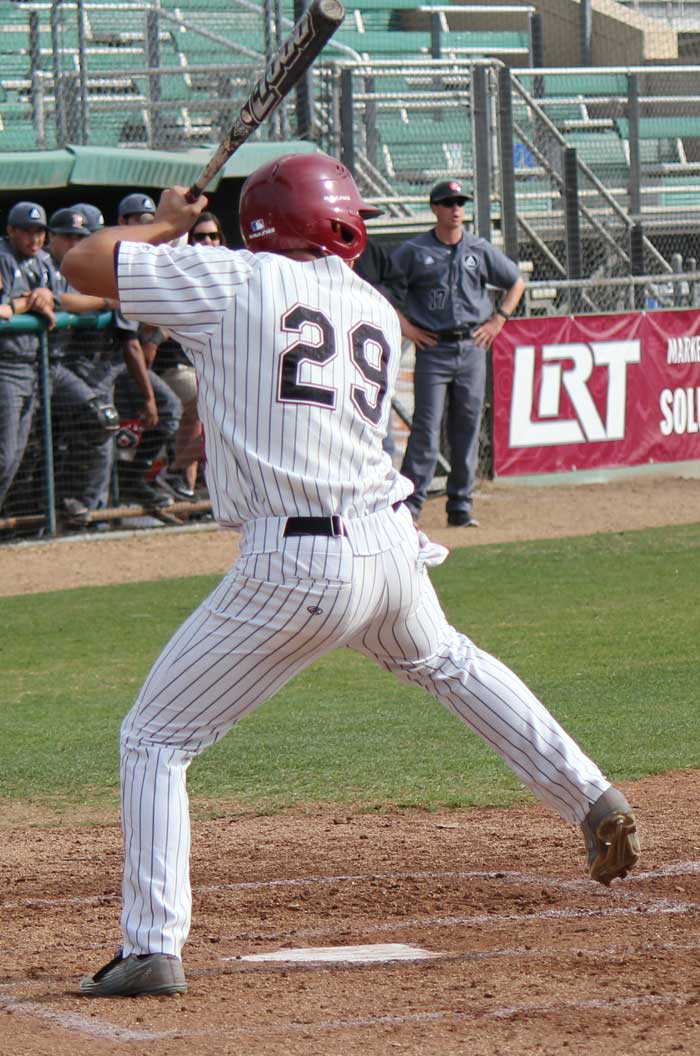 Junior Sonny Cortez loads up for a pitch against Academy of Art. Photo credit: Lindsay Pincus