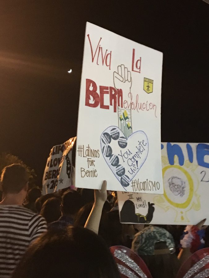 Bernie Sanders supporters show support of their candidate with posters. Photo credit: Amelia Storm