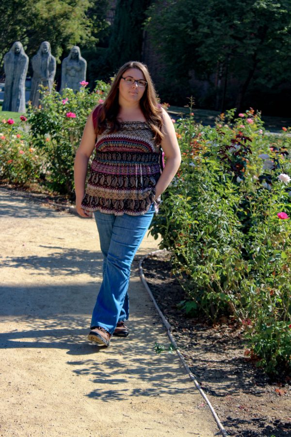 Aug. 26 - Sabrina Gabriel, a junior agricultural science and education major, kicks off her Friday with a stroll through the George Petersen Rose Garden.