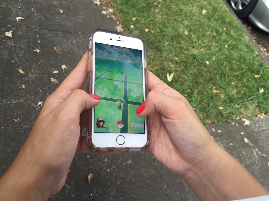 Chico State student plays Pokemon Go. Photo credit: Carly Plemons