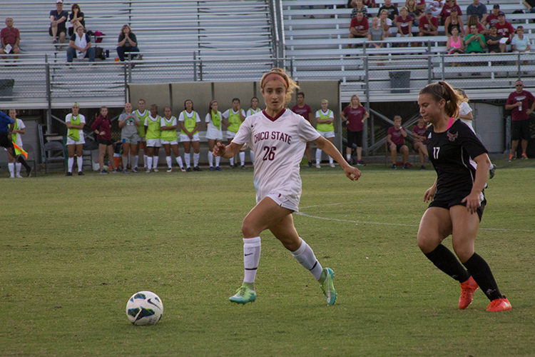 Junior defender Brooke Coelho looks for a teammate to pass the ball to. Photo credit: Aubrie Coley