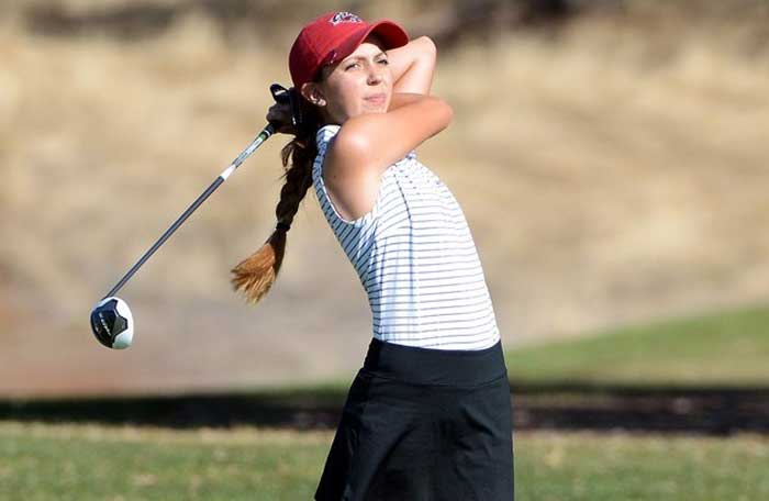 Abbey McGrew checks her swing during a Cats tournament last year.  Photo Courtesy of Abbey McGrew.