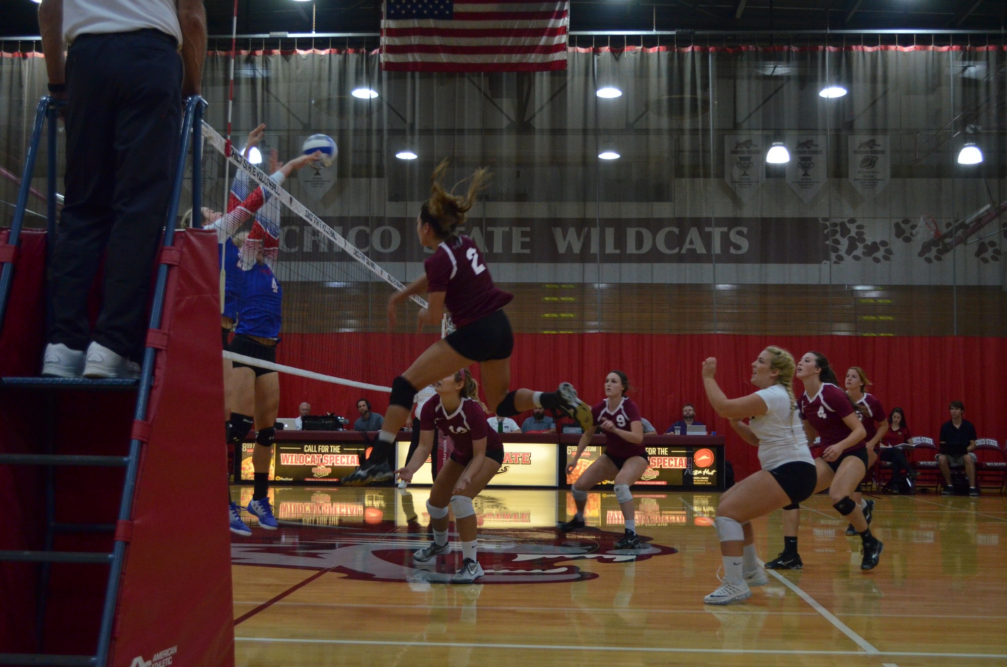 Olivia Mediano delivers a kill during the 'Cats preseason home game. Photo credit: Jordan Jarrell