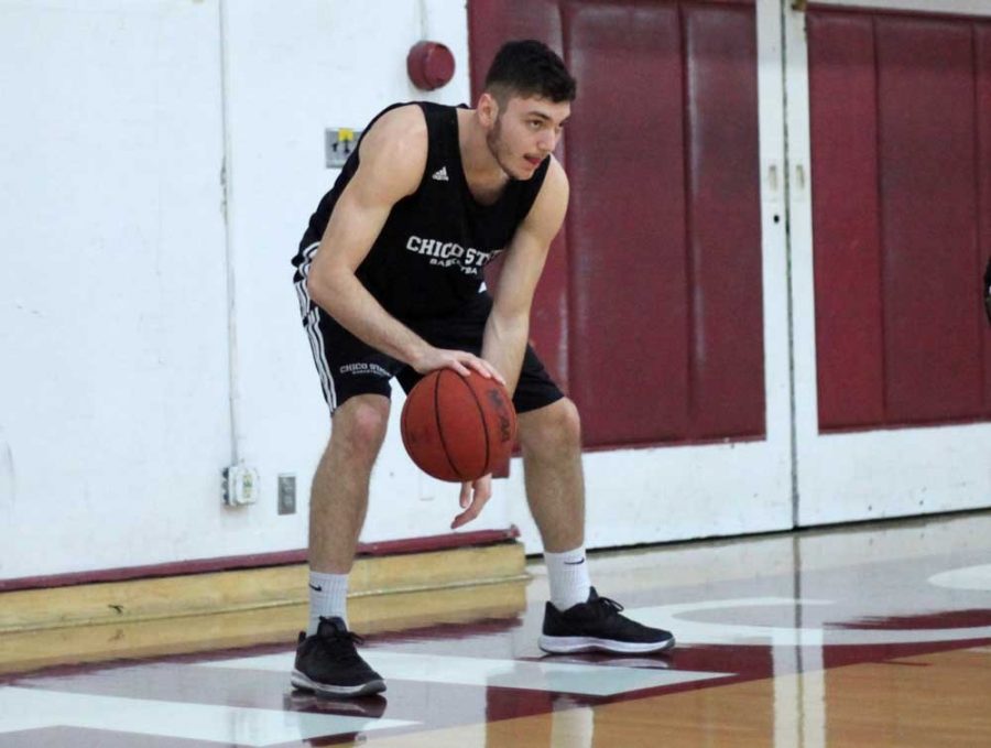 Corey Silverstrom practices dribbling before a game. Photo credit: John Domogma