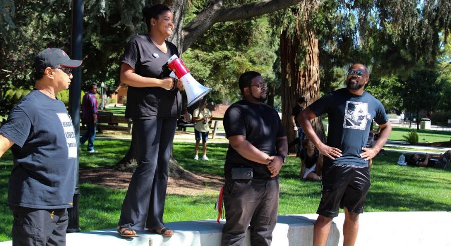 Chico State Faculty speak to students, faculty and alumni on Monday afternoon during the #BlackInChico protest at Trinity Commons. Photo credit: Jae Siqueiros