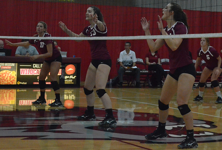 The Wildcats get into position before the opening set during a home game. Photo credit: Jordan Jarrell