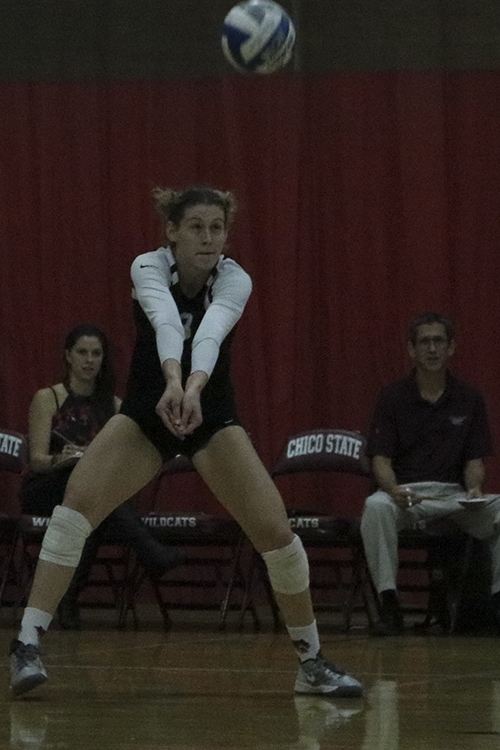 First-year outside hitter Kim Wright hits the ball during a Wildcat home game. Photo credit: Jovanna Garcia