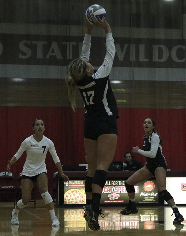 Senior setter Torey Thompson jumps to set the ball during a Wildcats home game. Photo credit: Jovanna Garcia