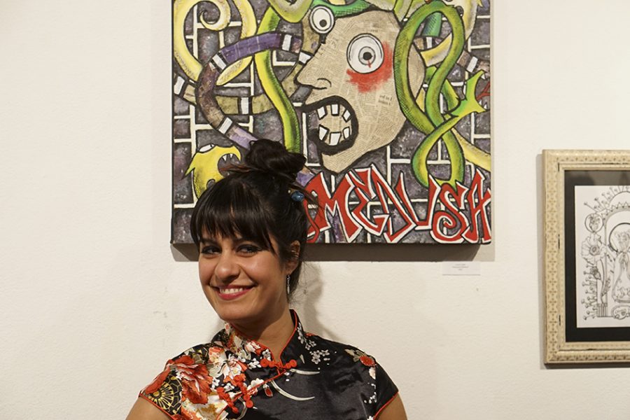 Lucia Lujan, Graphic Design major at Butte College posing with her Medusa piece at the Keep Chico Weird art show. Photo credit: Jordan Rodrigues
