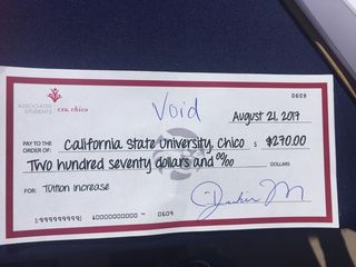 Chico state students handed out voided checks to campaign against tuition increase. Photo credit: Jacqueline Morales