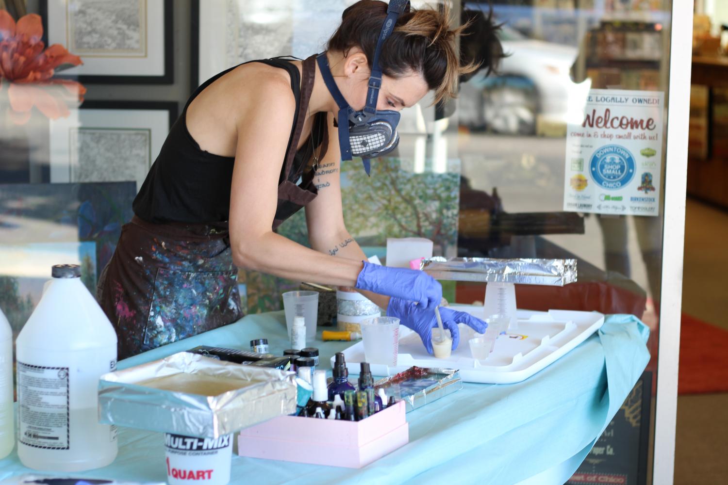 Kathryn Silvera makes the resin - a two-part mixture of hardener and gloss coat