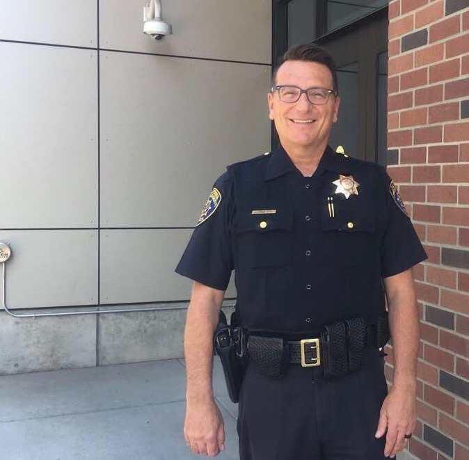 John Reid, acting police chief for the Chico State campus, standing in front of the university police department building. Photo credit: Natalie Hanson
