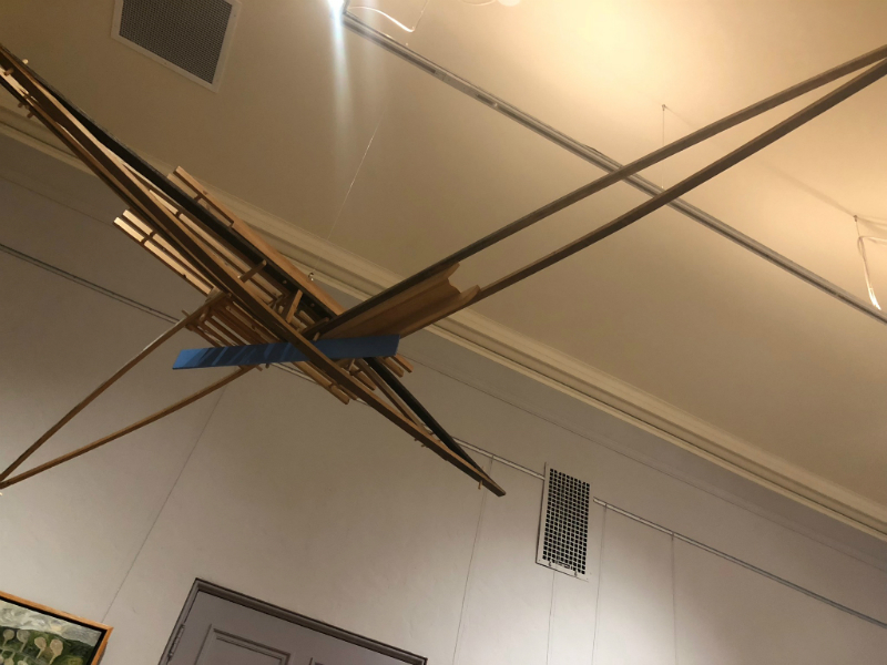 A wooded suspended sculpture inspired by boats. Most of the pieces of wood are found from repurposed wood found at yard sales.