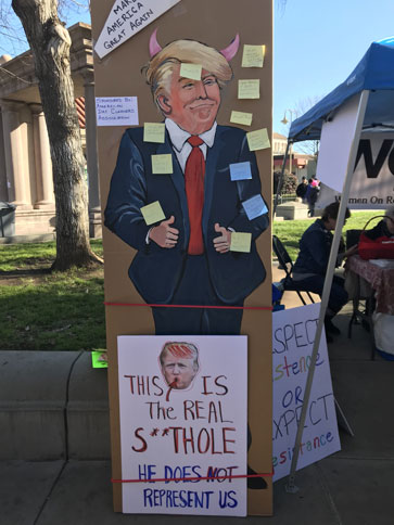 A painting of President Donald Trump on display at the Womans March 2018 at the Downtown Plaza in Chico. Photo credit: Hannah Yeager