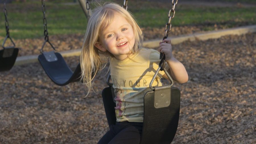 Eliza Lee plays on the swing set at Five Mile, Bidwell Park, on Monday while spending time with her grandmother. Photo credit: Carly Maxstone