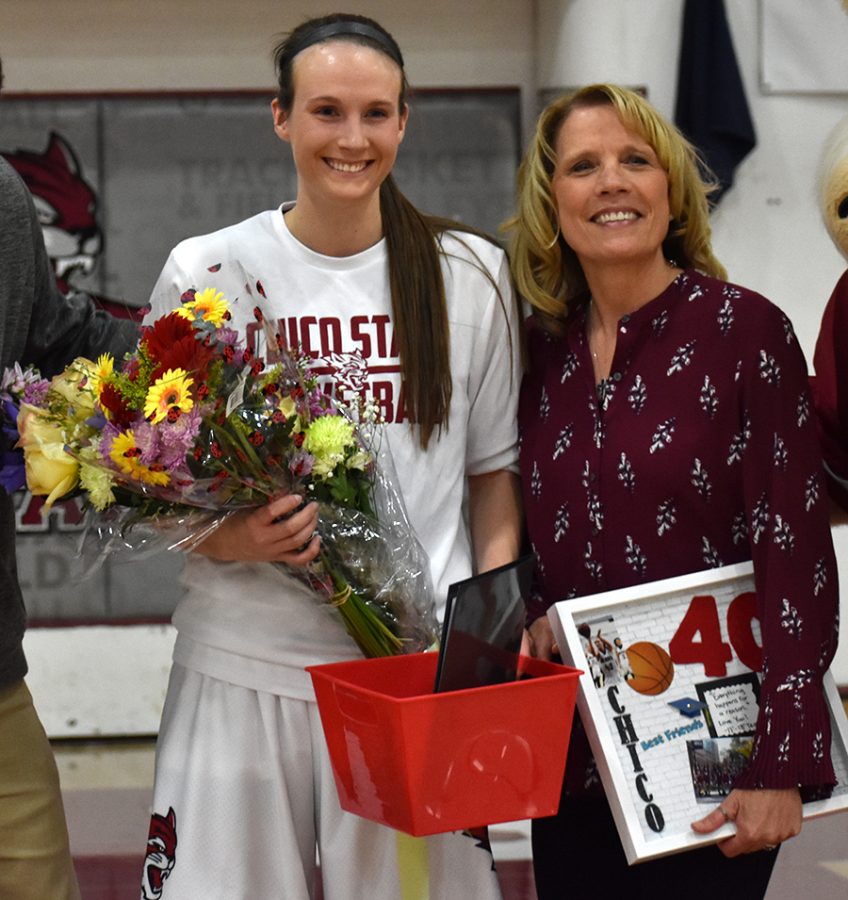 Senior Haley Cremen, left, poses with her mother, Penni Cremen. Cremen was one of four seniors  honored during Saturdays Senior Night. Photo credit: Martin Chang
