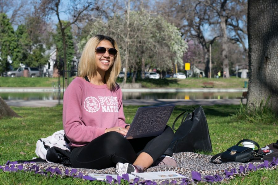 Chico resident, Kaesha Abrams, enjoys the Friday morning sunshine with a study session at Bidwell Park Photo credit: Kate Angeles