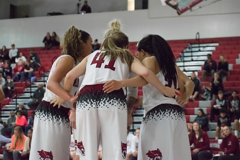 Whitney Branham, McKena Barker, Jo Paine and Shay Stark huddle up in a matchup against UC San Diego Photo credit: Kate Angeles