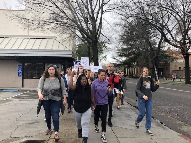 Students make their way from the City Plaza to the Trinity United Methodist Church.