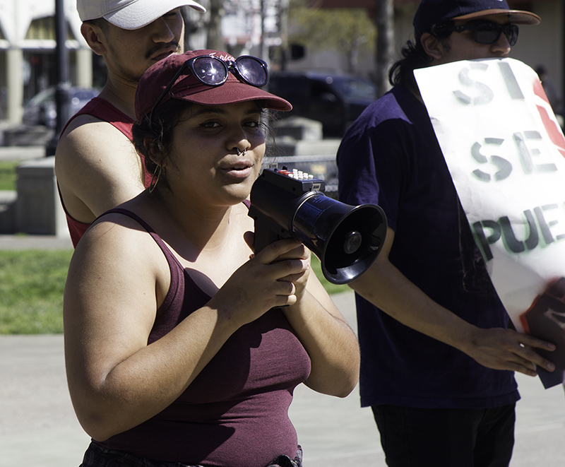 Diana Castellanos shares her feelings on Cesar Chavez Day celebrations with participants in the City Plaza Saturday.