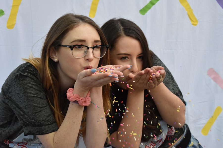 Philanthropy Chairs Alyssa Bounds (left) and Shelby Wood (right) celebrate Alpha Omicron Pis event Scoop Out Arthritis. The event included a sundae bar, all you can eat ice cream and raffles to win themed baskets. All proceeds went towards the Arthritis Foundation.