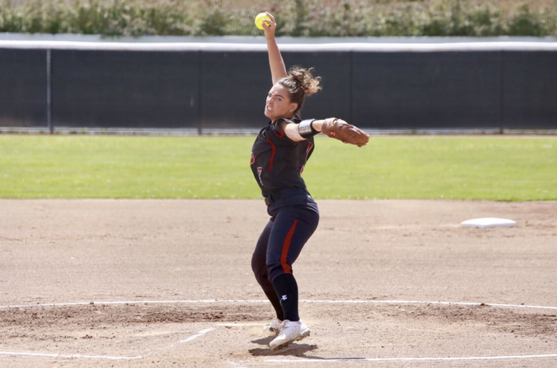 Pitcher Haley Gilham winding up for a pitch against San Francisco State. Photo Courtesy of Janna Weiss Photography
