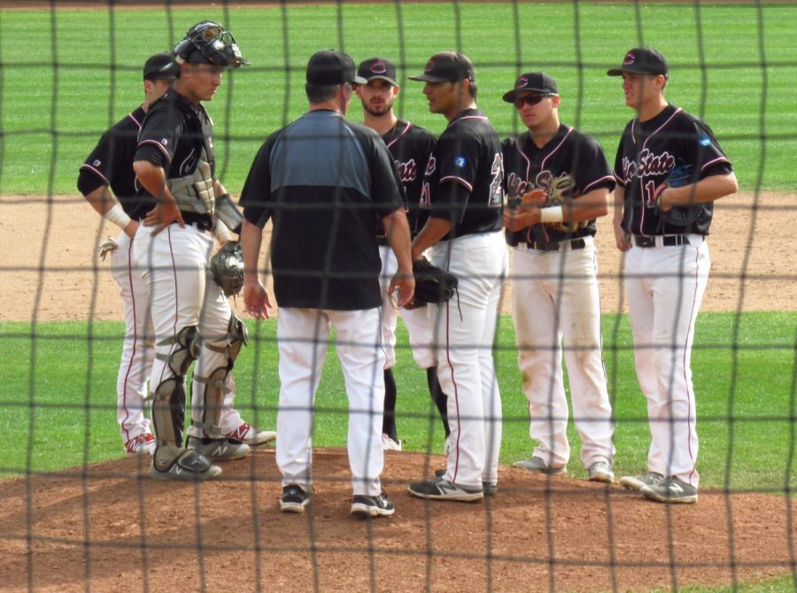 Chico State Head Coach Dave Taylor makes a mound visit and brings his whole infield in following back-to-back errors against Northwest Nazarene. Photo credit: Austin Schreiber