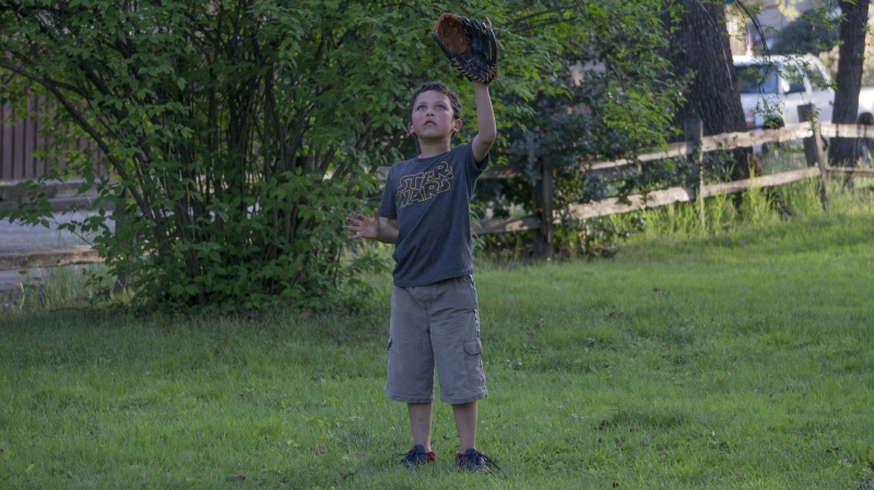 Vidal Hernandez Jr. plays catch with his father on Bidwell Park this Sunday. Photo credit: Carly Maxstone