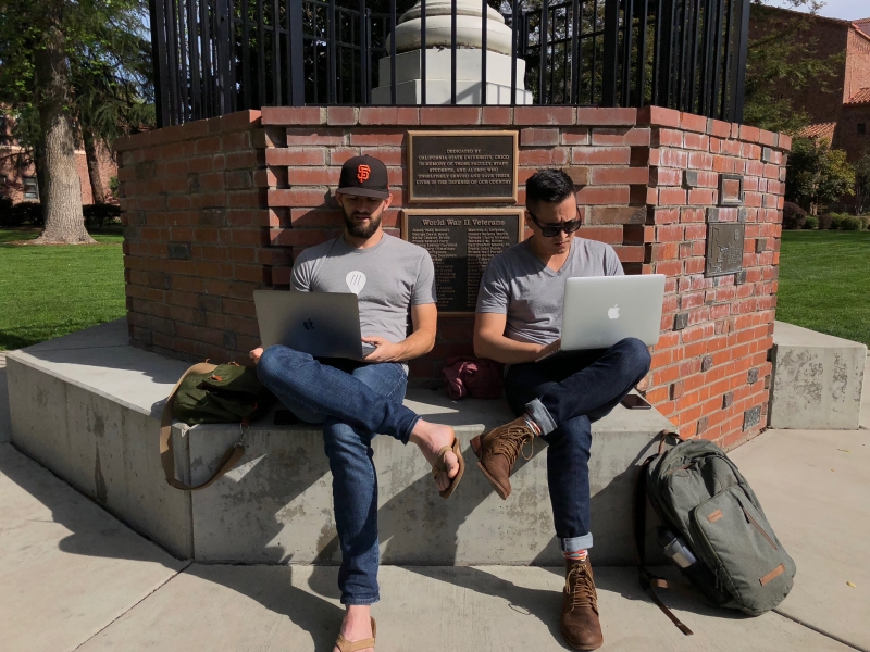 On April 3rd, Josh Payne and Andrew Burger enjoy the weather by working on projects outdoors. Photo credit: Maria Ramirez