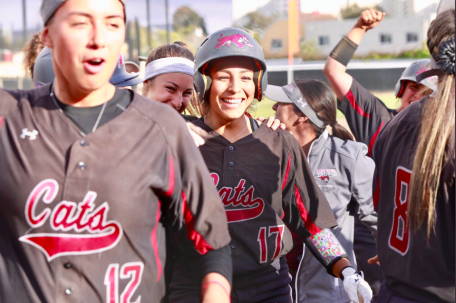 Amanda Flores celebrating with teammates moments after hitting the game tying grand slam against San Francisco State. Photo Courtesy of Jana Weiss