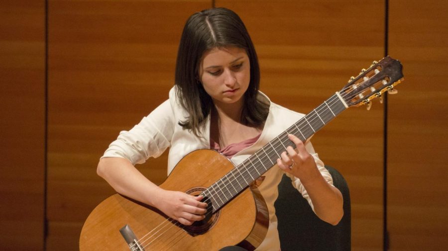 Briaunna Cisneros plays the opening piece for the ensemble performance. Photo credit: Carly Maxstone