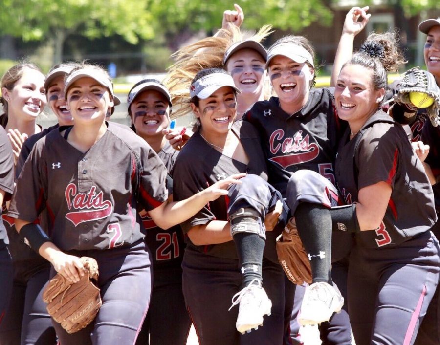 Chico State shortstop Wendy Cardinali is carried off the field by teammates Haley Gilham and Amanda Flores. Cardinali made a diving catch at shortstop with the tieing run at third base and the go-ahead run at second to end the game. Photo Courtesy: Janna Weiss Photography