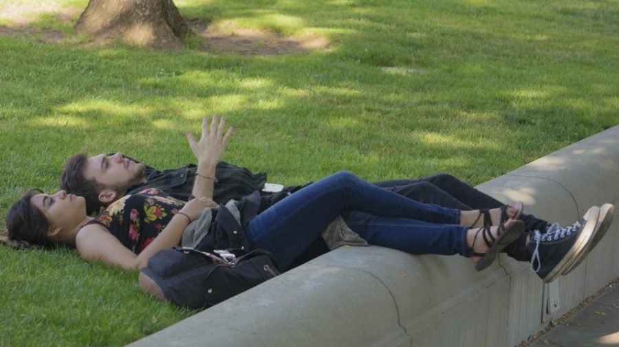 Butte College students Ashley Claus and Edward Little relax at the city plaza this Friday. Photo credit: Carly Maxstone
