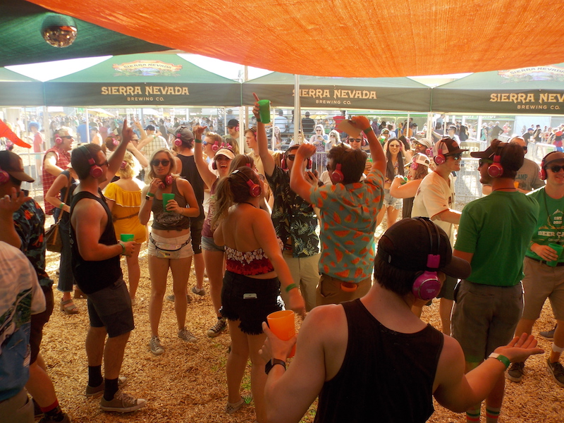 Pink headphones played music directly to dancing campers Saturday at Beer Camp, allowing a dance party without the music overpowering the other activities Photo credit: Josh Cozine