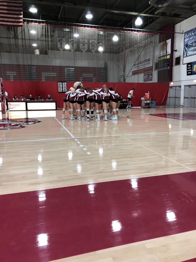 Chico State huddles before the start of the first set on Saturday in a game against Cal State East Bay. Photo credit: Lucero Del Rayo-Nava