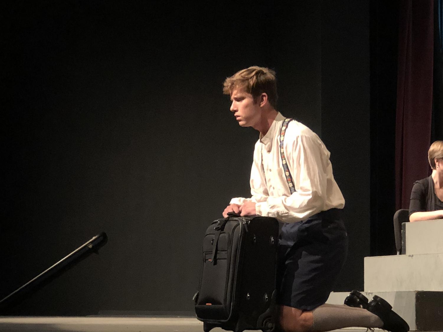 Candide (Valdis Birznick) singing during a musical number. Photo credit: Alex Coba