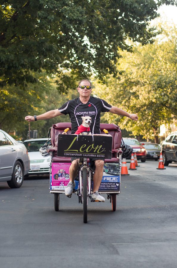 Mike G rides his pedicab in downtown Chico.