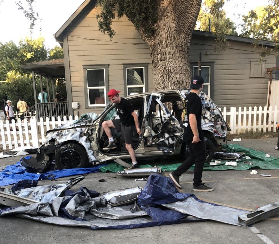 Jack Mason (current member of Sigma Nu) and James Sandlin (current member of Sigma Nu) survey the damage of the car. Photo credit: Brooke Martin