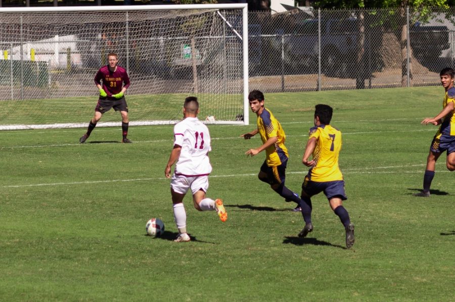 Chico State Midfielder, Cooper Renteria, looks to shoot the ball against UC Santa Cruz in this archived photo. Photo credit: Maury Montalvo