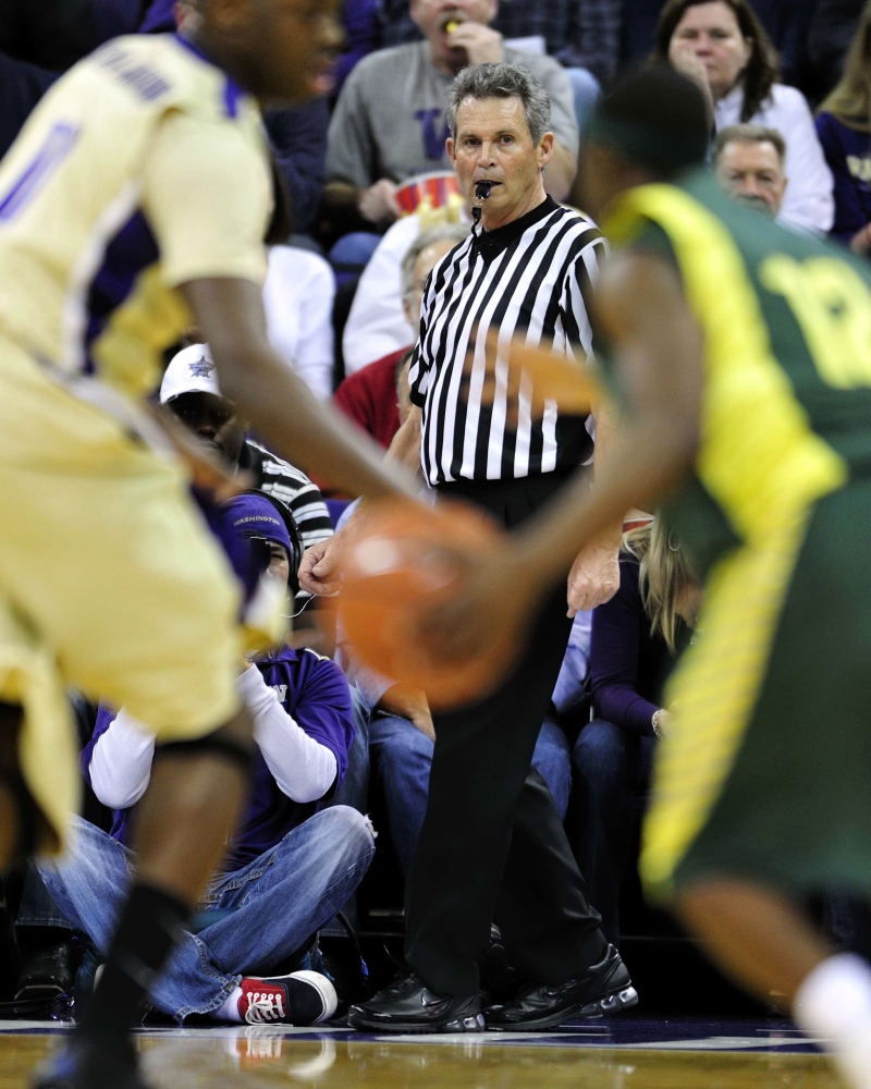 Reischling officiating University of Oregon basketball match. Photo courtesy of Mark Reischling.